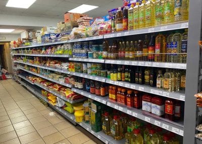 Asian Supermarket shelves, stocked with many different oils.